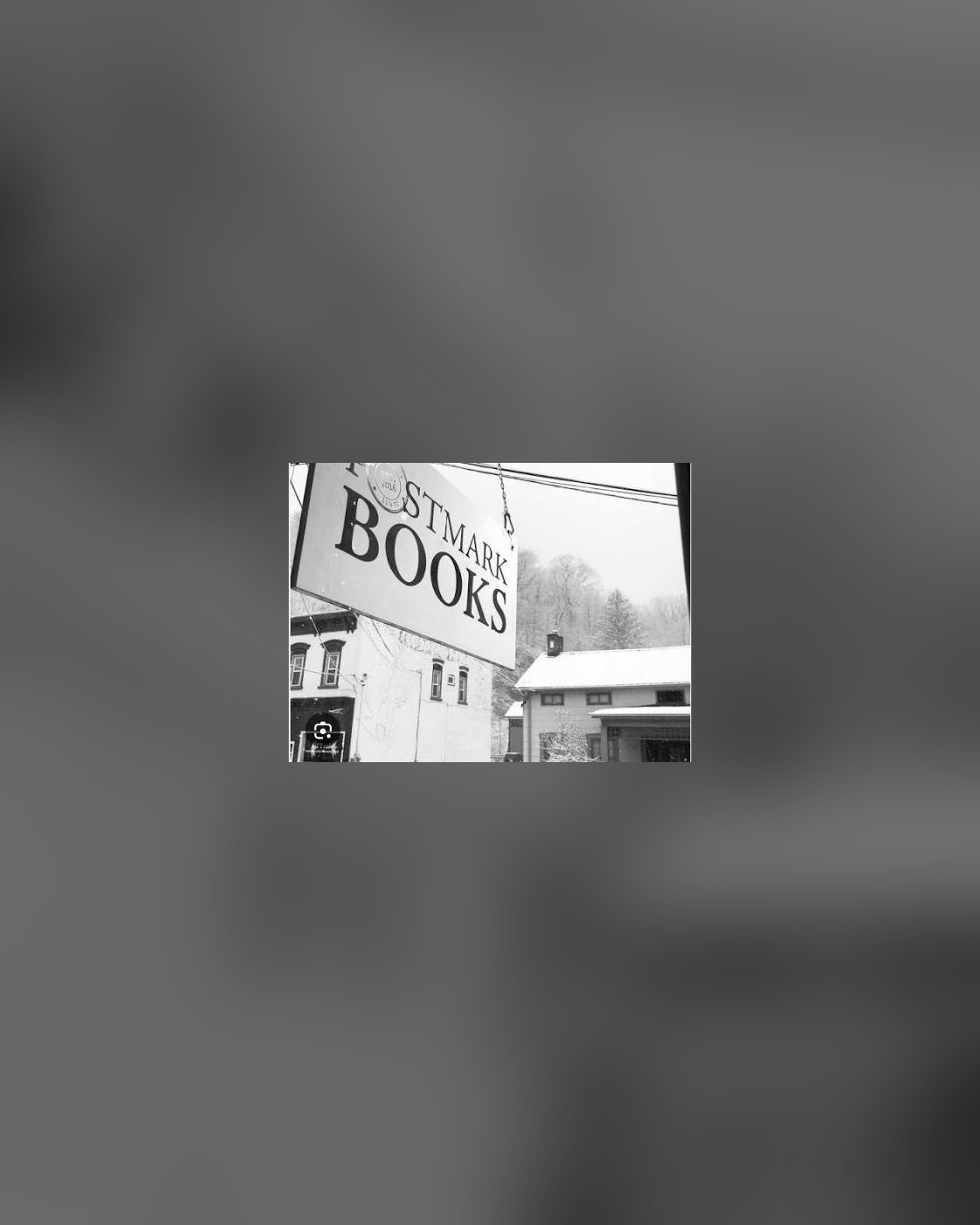 The Postmark Books sign over Main Street in Rosendale