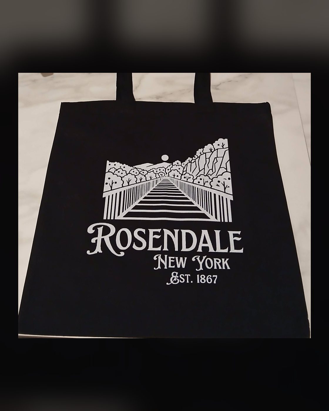 Rosendale tote in black with the trestle design, carried at Postmark Books